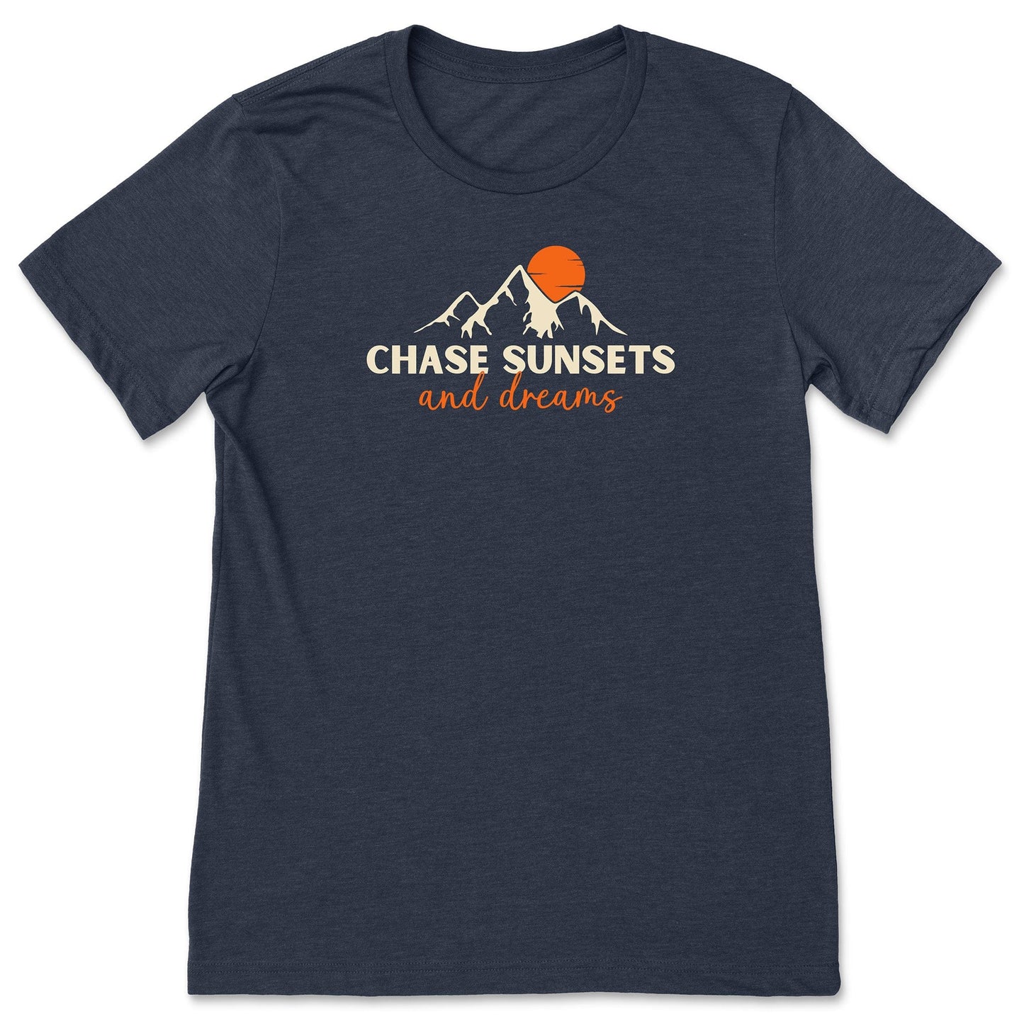 A navy chasing sunsets t-shirt that has mountains with an orange sunset and says, "Chase Sunsets and Dreams."