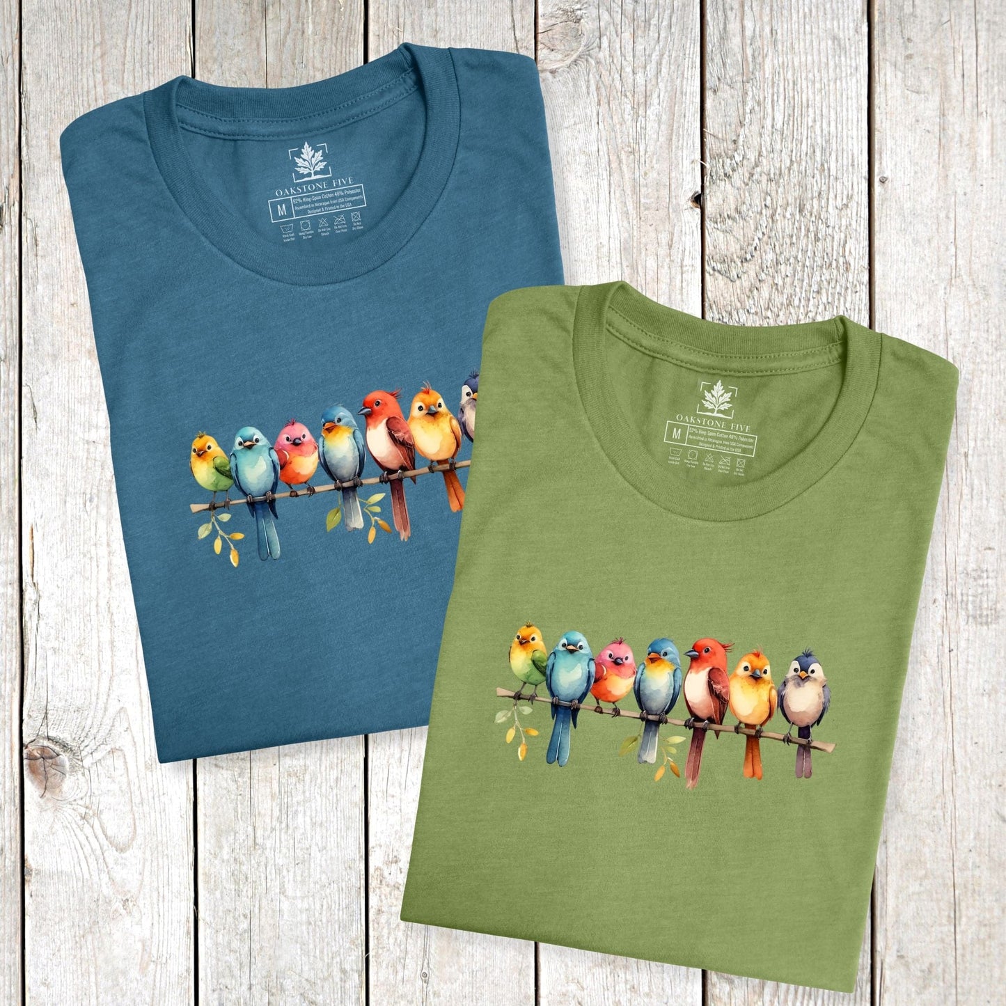 Folded, cute bird t-shirts for nature lovers and birders, that has a row of colorful birds sitting on a branch.