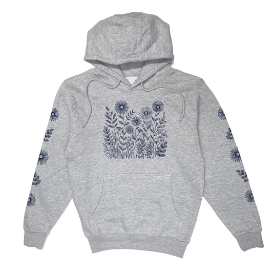 Light gray hoodie with floral patterns of navy wildflowers on the front and down both sleeves.