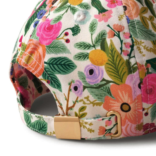 The gold metal slide on an adjustable women's floral baseball-hat.