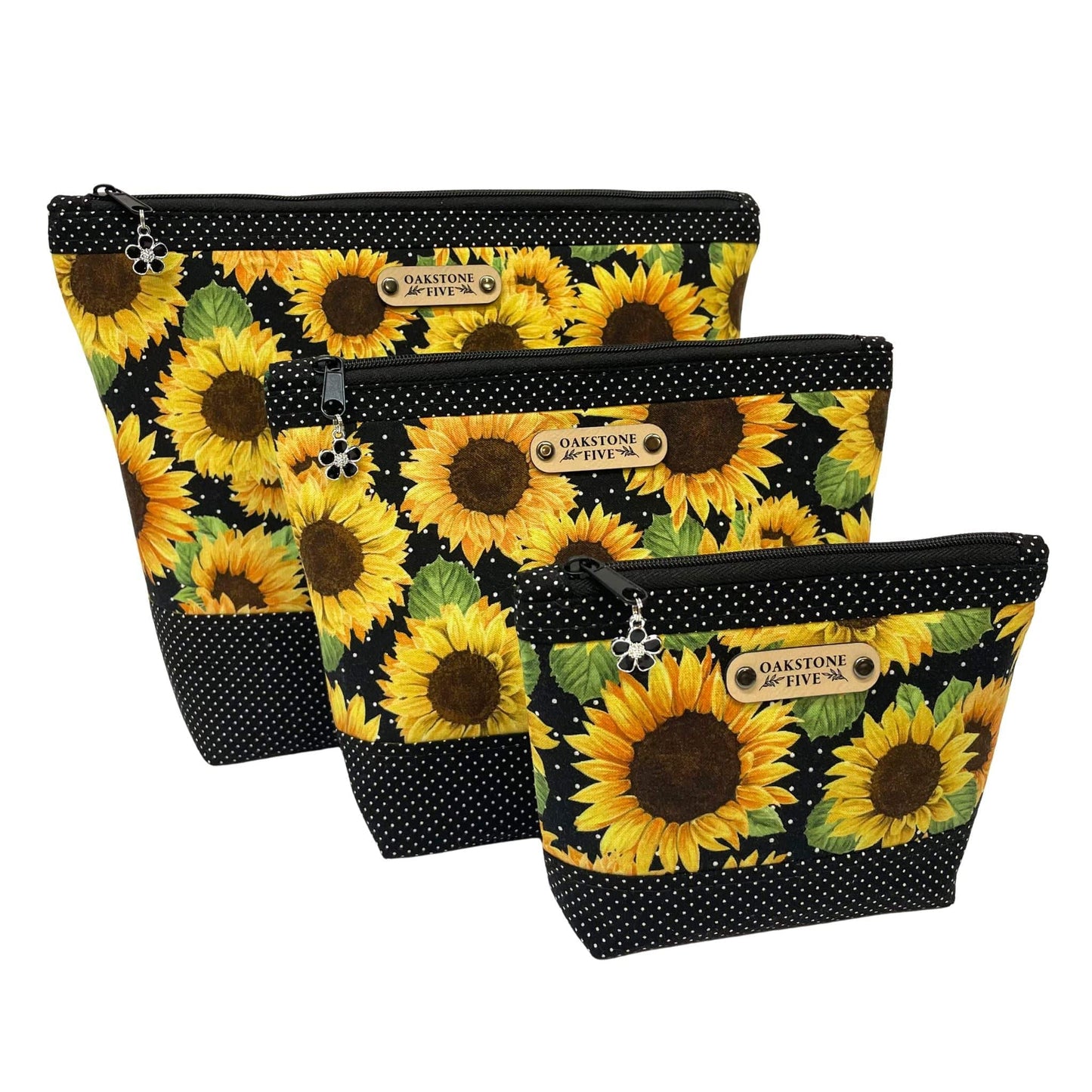 Three sizes of sunflower zipper pouches with black and white polka dots accent pattern, on a white background