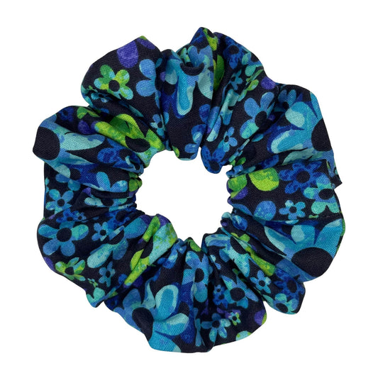 A cute, blue and green daisy floral scrunchie that's handmade using high-quality, 100% cotton fabric.
