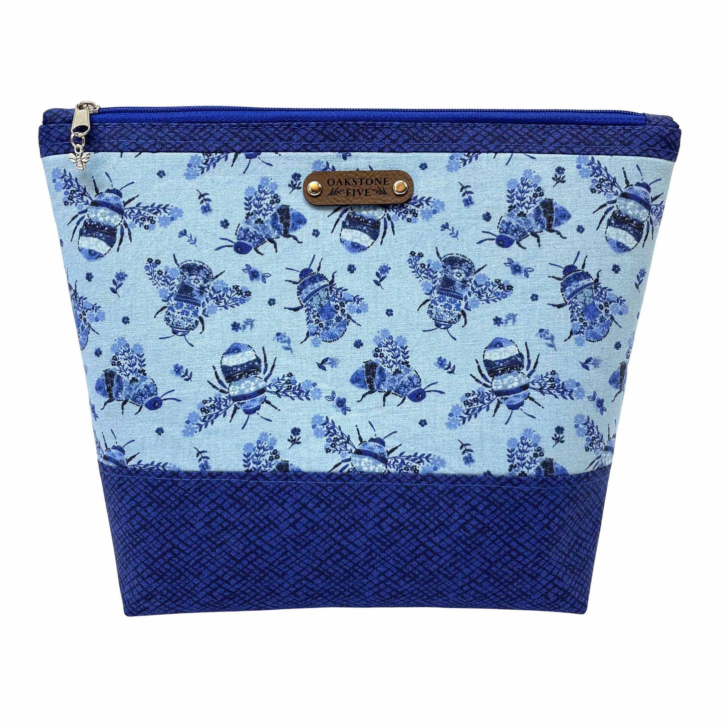 Blue floral bumble bee patterned zipper pouch with a white background