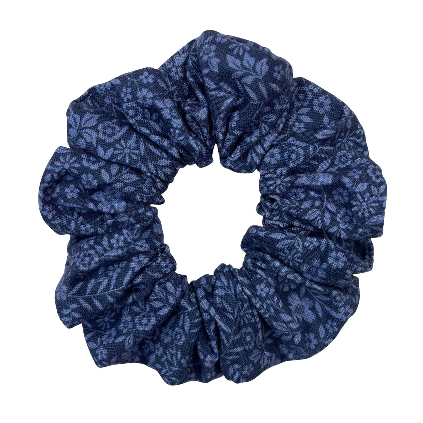 Blue floral patterned scrunchie on a white background