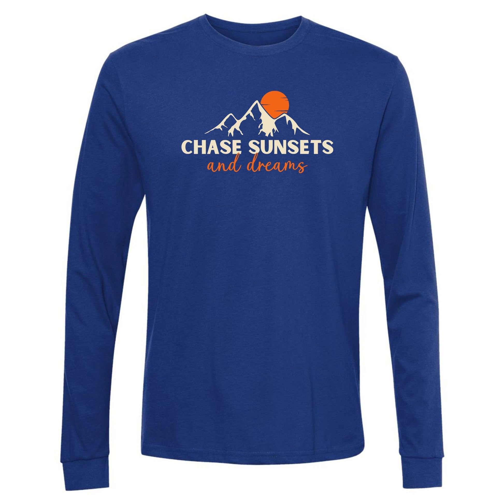 A royal blue, long-sleeve chasing sunsets shirt for nature lovers. Has an image of a mountain range and sun and says, "Chase Sunsets and Dreams."
