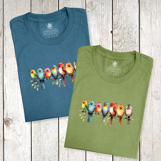Folded, cute bird t-shirts for nature lovers and birders, that has a row of colorful birds sitting on a branch.