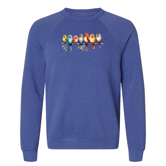 A cute bird sweatshirt that has a row of colorful birds sitting on a tree branch.