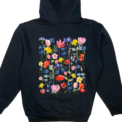 The back of a beautiful wildflower hoodie for flower lovers! It has vibrant flowers on the front, the back, and down both sleeves! 