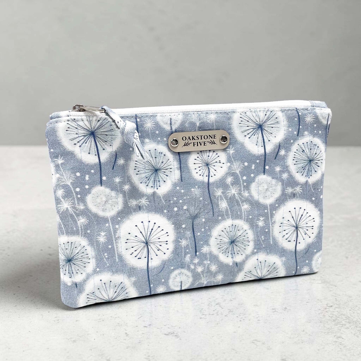 Zipper Pouch with dandelion pattern on a gray background