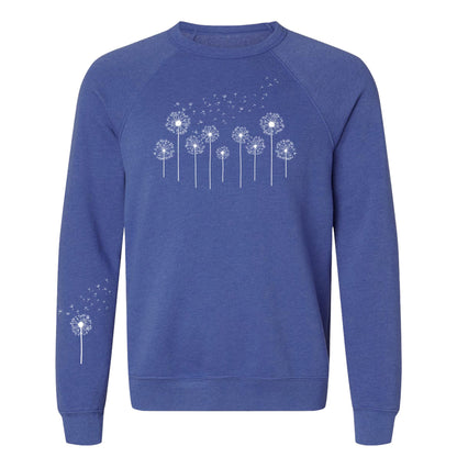 Blue sweatshirt with white dandelion graphics on a white background