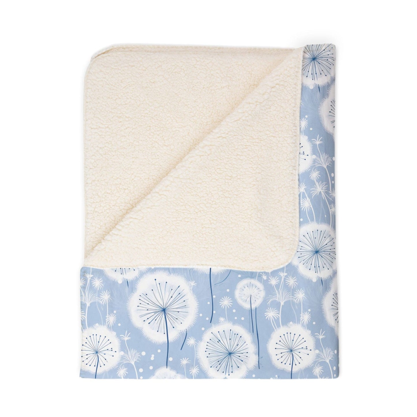 Sherpa blanket with white dandelion pattern on a blue background