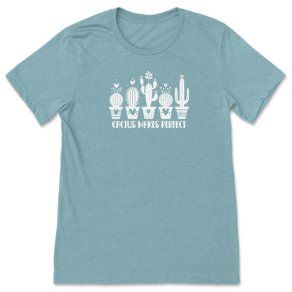 A light blue, funny cactus t-shirt for plant lovers, that says "Cactus Makes Perfect."