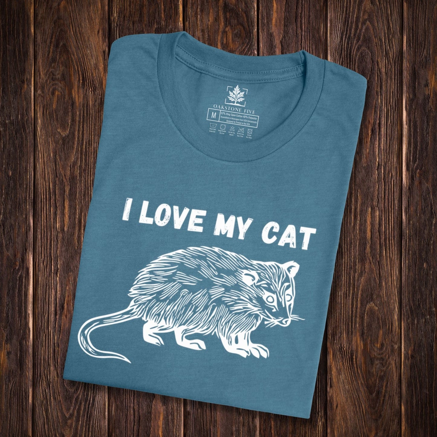 A teal, funny possum shirt for animal lovers that says, "I love my cat".