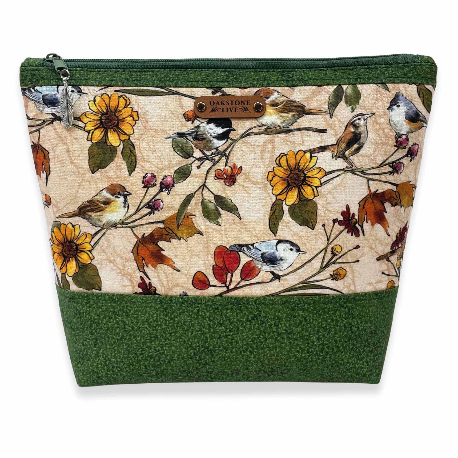Handmade, nature-themed zipper pouch with bird and floral pattern on a white background