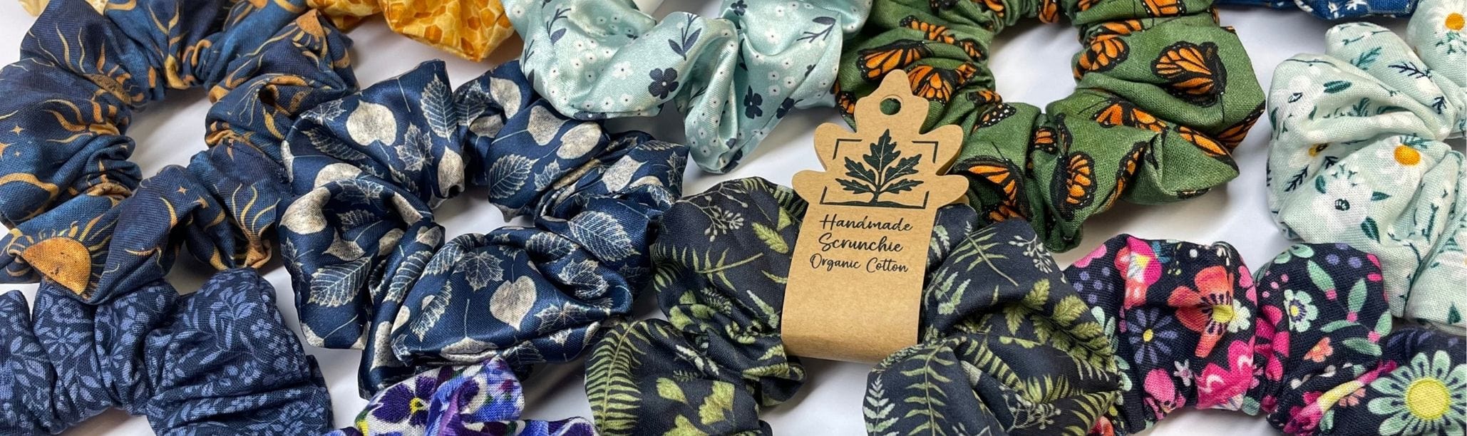 A group of colorful, handmade nature scrunchies.