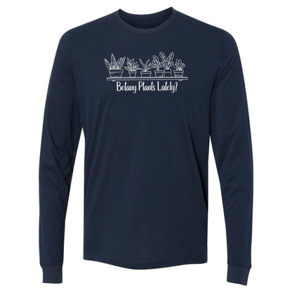 A navy, long-sleeve, funny botany shirt for plant lovers that has a design with a row of potted plants on a shelf and says, "Botany Plants Lately?"