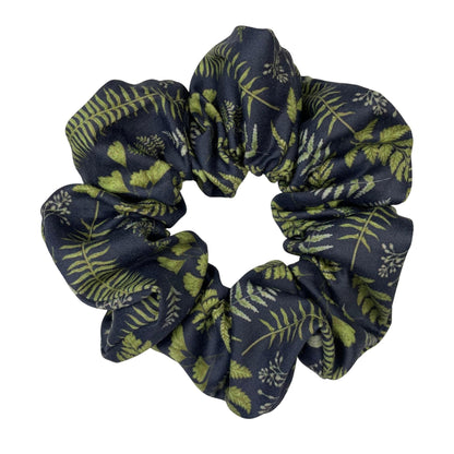 A navy ferns and leaves scrunchie made from soft, premium organic cotton fabric and is perfect for nature lovers.