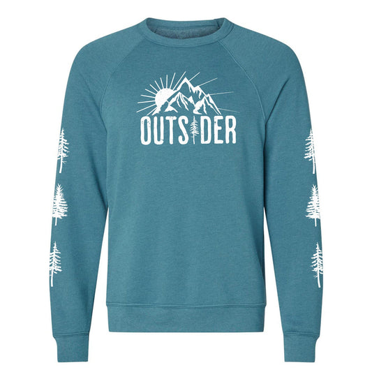 A teal, ultra-soft raglan sweatshirt for nature lovers and outdoor enthusiasts that has a sun behind a mountain and says, "Outsider", and has trees down both sleeves. 