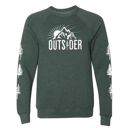 A forest green, ultra-soft raglan sweatshirt for nature lovers and outdoor enthusiasts that has a sun behind a mountain and says, "Outsider", and has trees down both sleeves. 