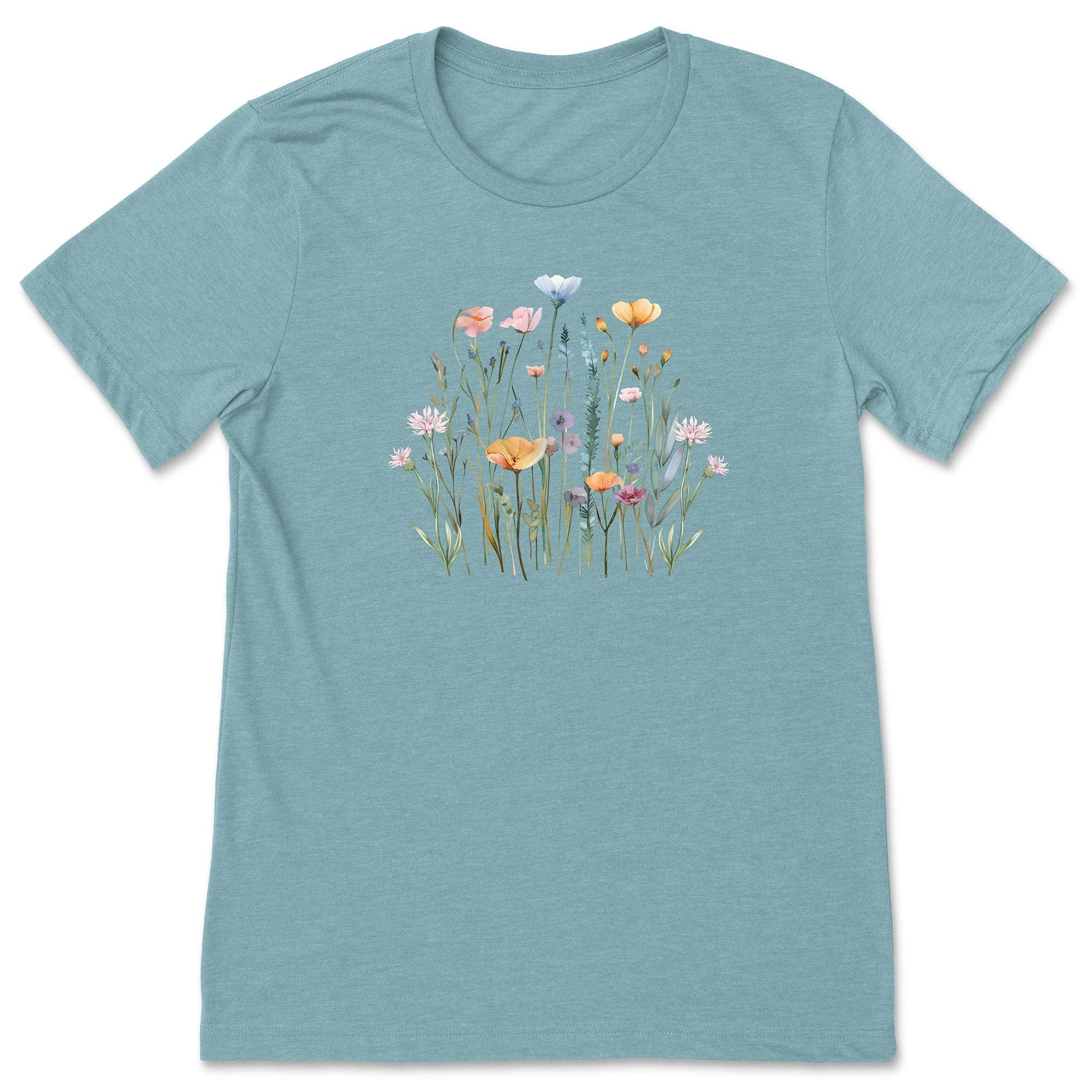 A pretty light blueish, soft, wildflower shirt for women and gardeners that has a print with pastel flowers on it. 
