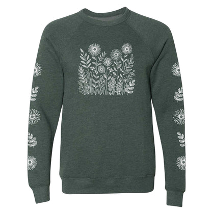 Green sweatshirt with white floral patterns on the front and on both sleeves, on a white background