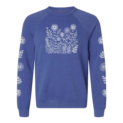 Blue sweatshirt with white floral patterns on the front and on both sleeves, on a white background