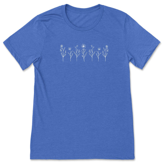 A cute, royal blue, wildflower t-shirt that has white flowers on it - great for nature and flower lovers! 
