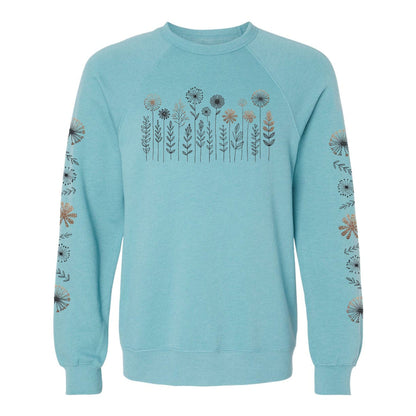Light blue crewneck sweatshirt with floral pattern on the chest and sleeves, on a white background