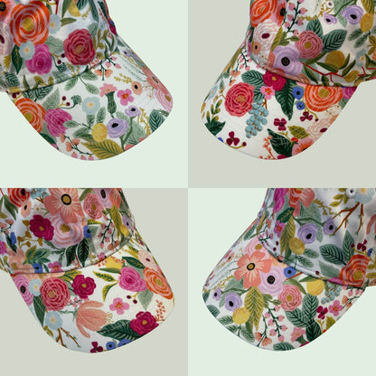 Various examples of the patterns on these pretty, women's floral baseball hats.