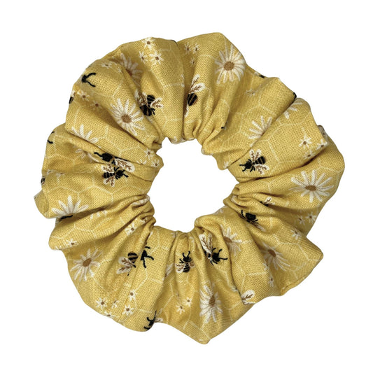 Yellow scrunchie with honey bee and floral pattern on a white background